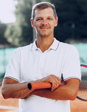portrait-of-positive-male-tennis-player-with-racke-2021-09-03-13-00-10-utc.jpg