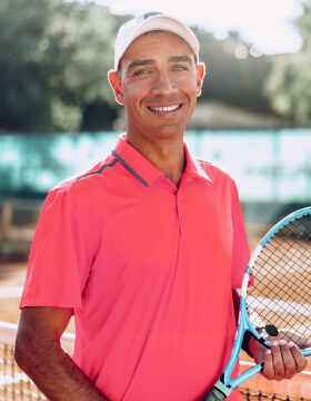 middle-aged-man-tennis-player-with-racket-standing-2021-09-03-17-21-09-utc.jpg